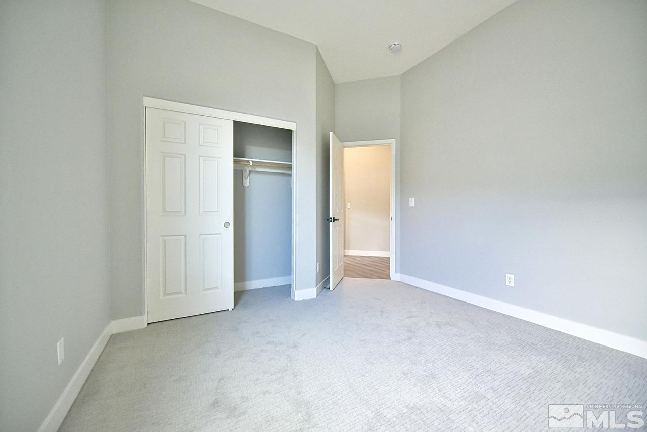 1680 Caliterra Way Reno, NV 89521 - Photo 22 of 34 an empty room with closet area