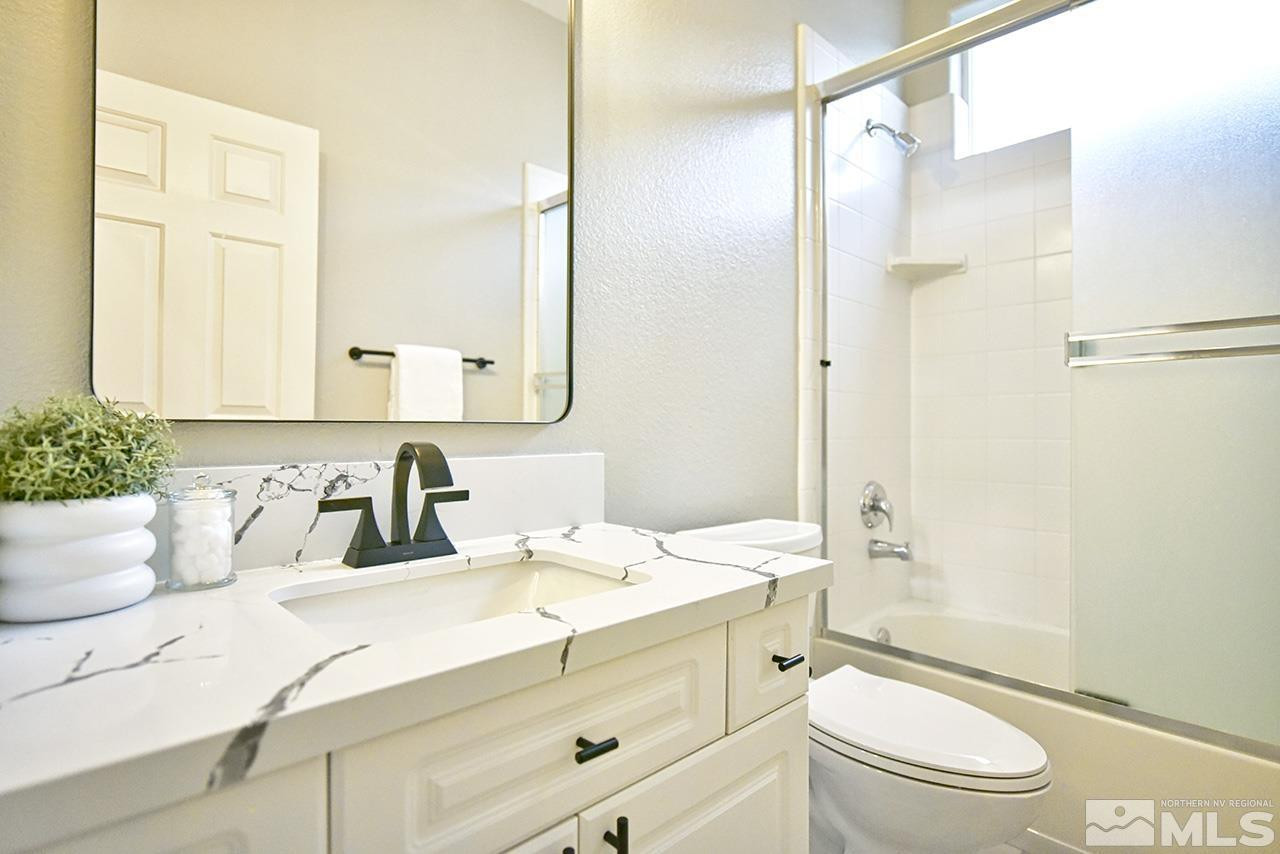 1680 Caliterra Way Reno, NV 89521 - Photo 23 of 34 a bathroom with a sink a toilet and shower