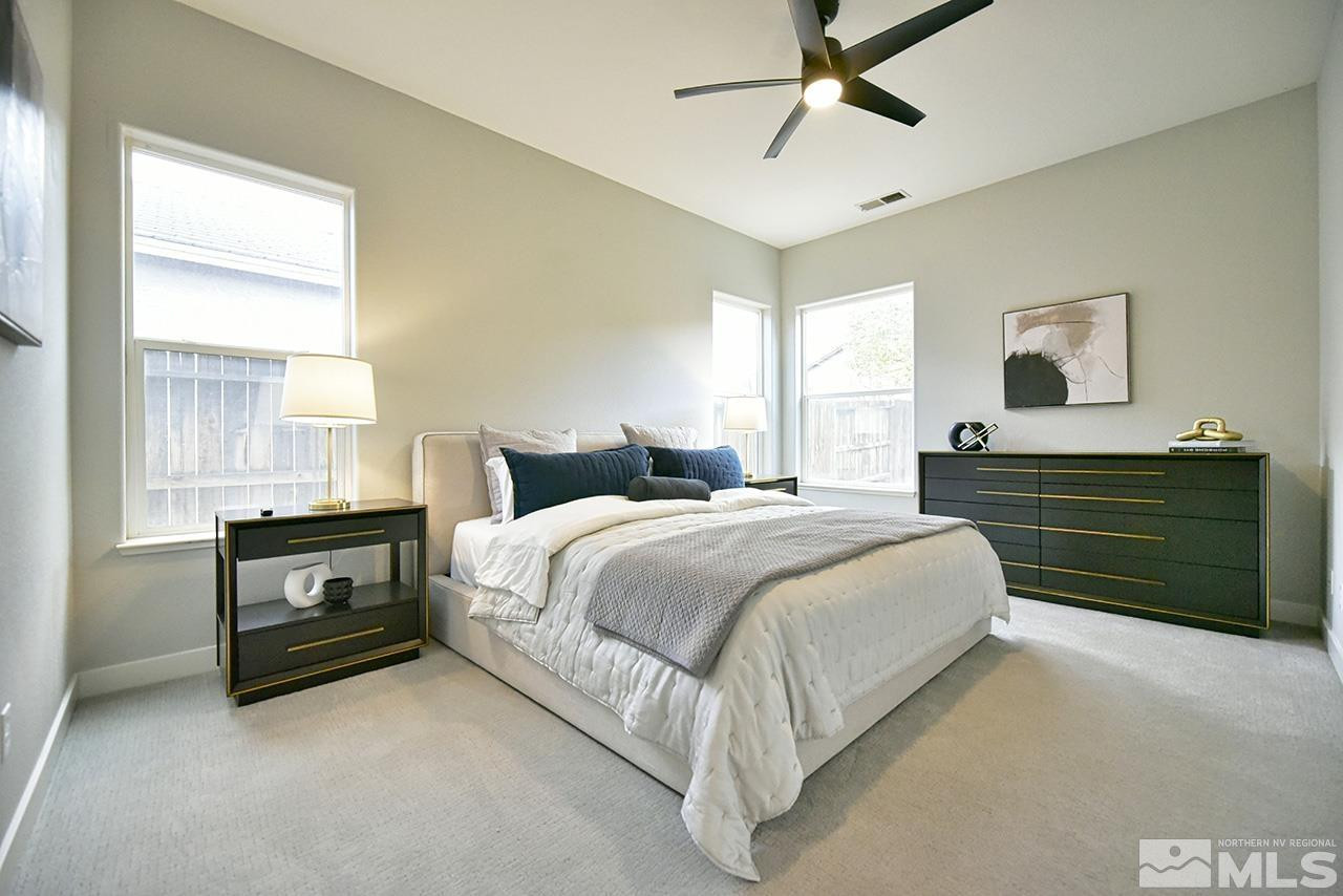 1680 Caliterra Way Reno, NV 89521 - Photo 26 of 34 a bedroom with a bed and window