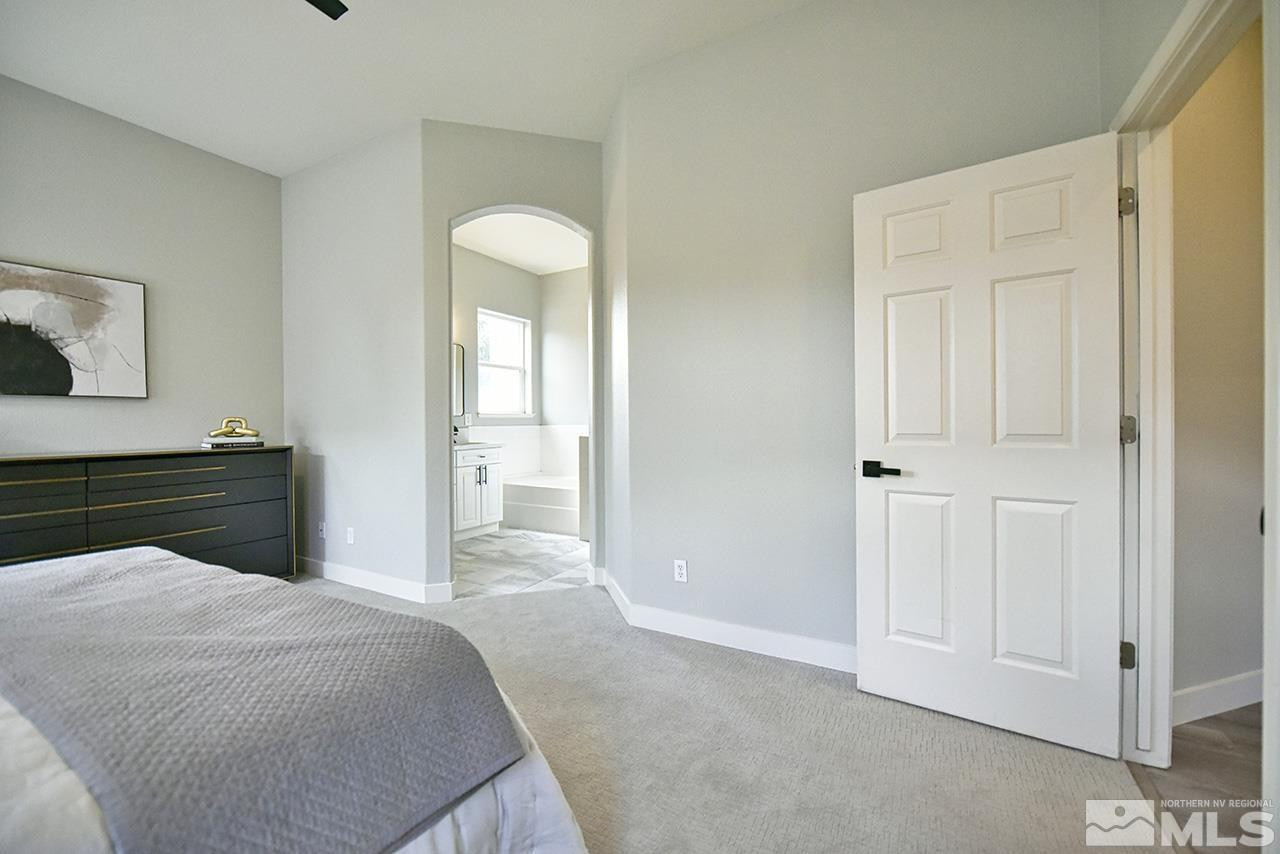 1680 Caliterra Way Reno, NV 89521 - Photo 27 of 34 a bedroom with a bed and cabinet