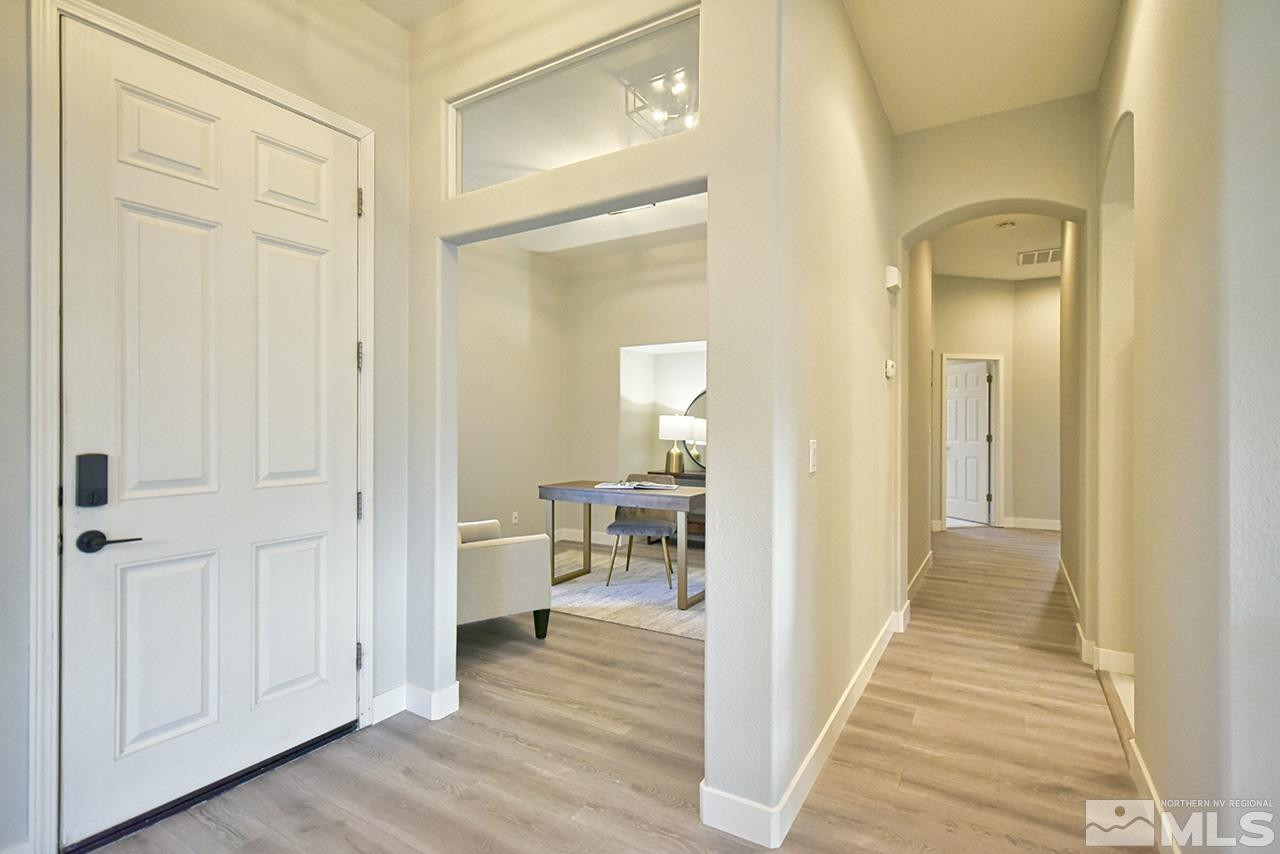 1680 Caliterra Way Reno, NV 89521 - Photo 3 of 34 a view of a bathroom from a hallway