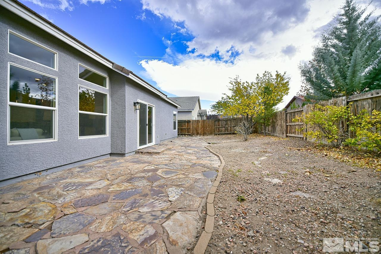 1680 Caliterra Way Reno, NV 89521 - Photo 32 of 34 a view of a house with a yard