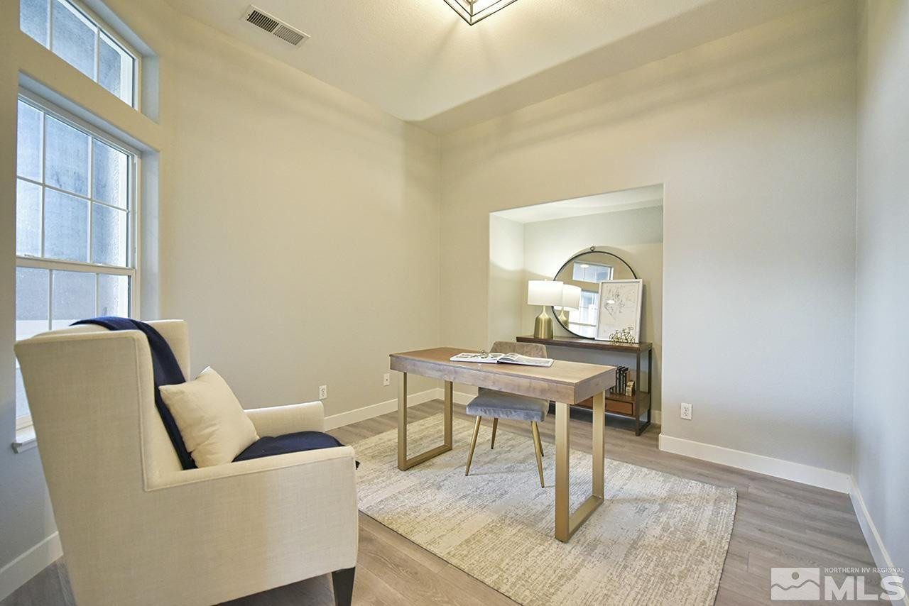 1680 Caliterra Way Reno, NV 89521 - Photo 4 of 34 a living room with furniture and a window