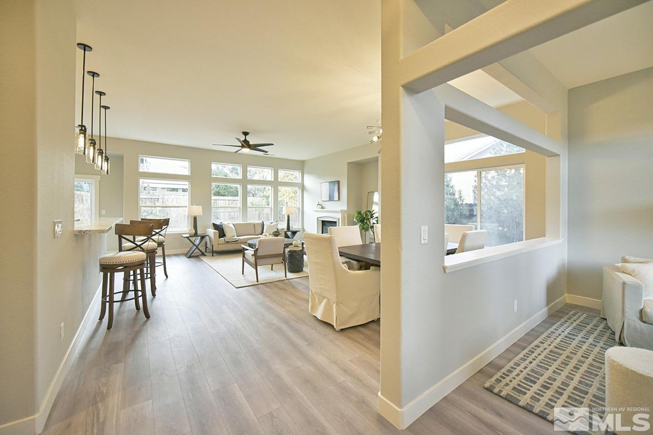 1680 Caliterra Way Reno, NV 89521 - Photo 6 of 34 a living room with furniture and a table