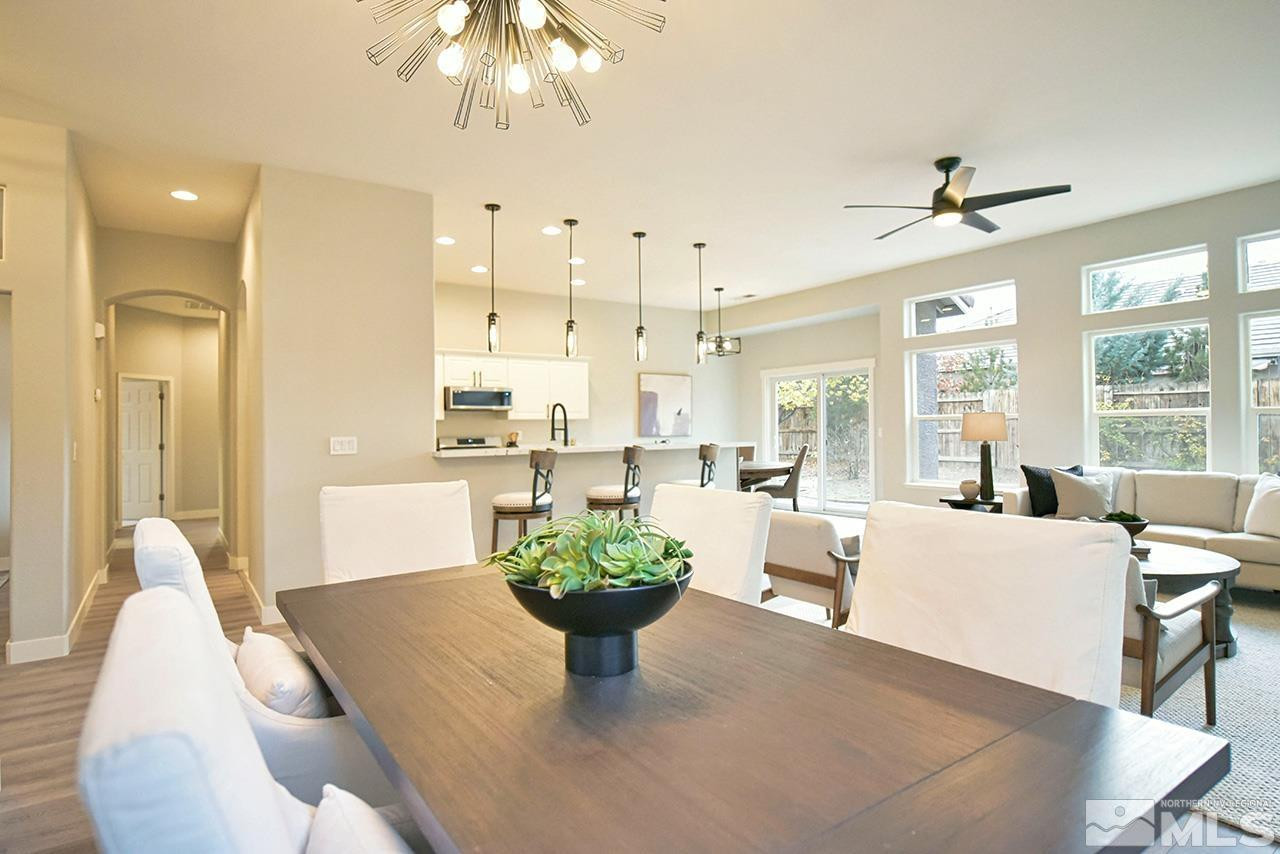 1680 Caliterra Way Reno, NV 89521 - Photo 8 of 34 a view of a dining room with furniture window and outside view