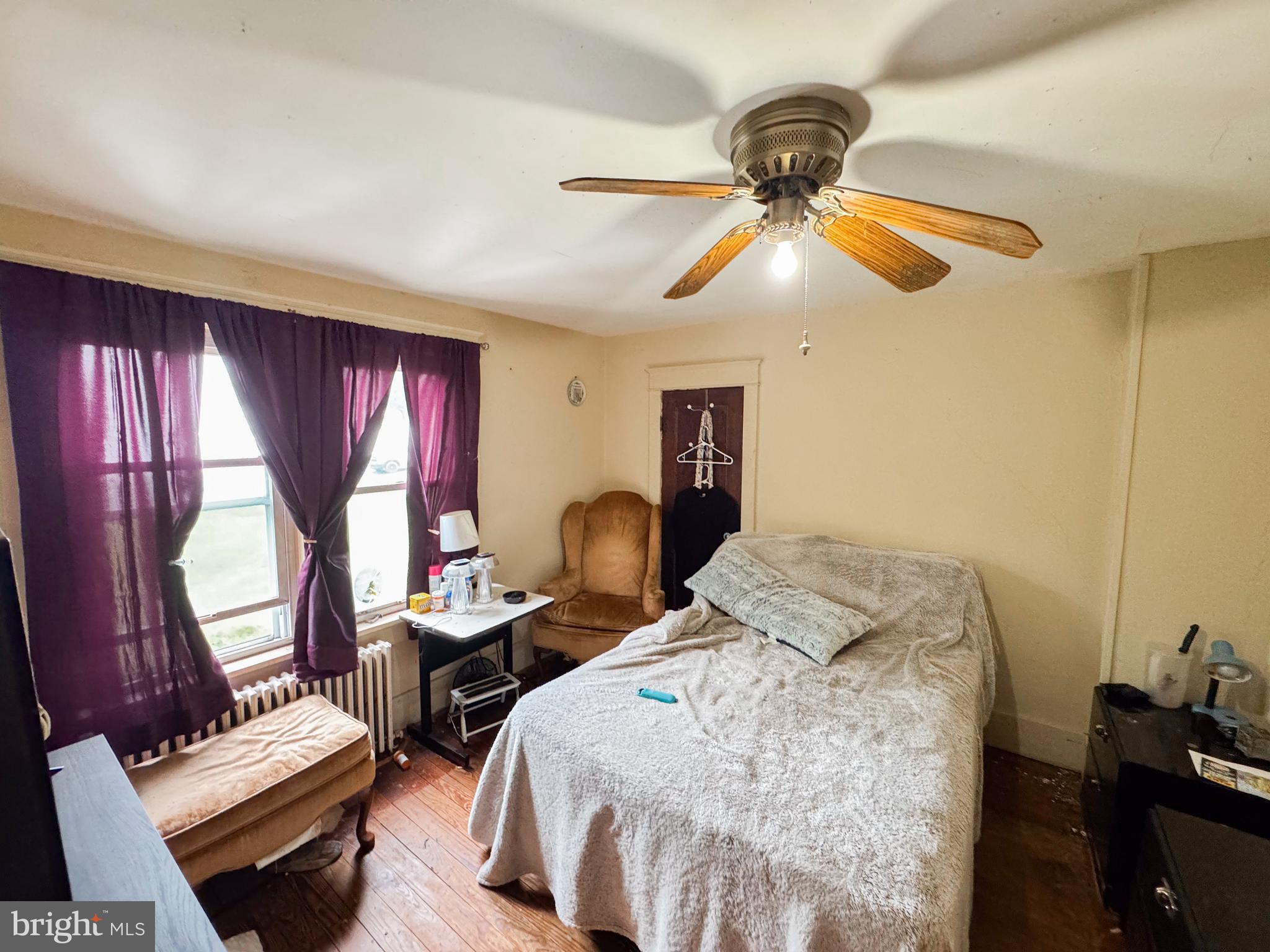 416 Dry Valley Road Burnham, PA 17009 - Photo 13 of 23 a bedroom with a bed and a chandelier