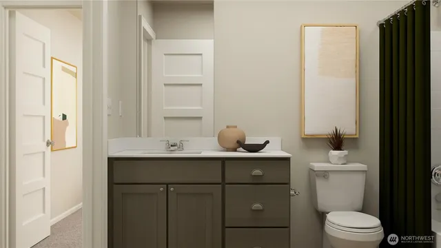 a bathroom with a toilet sink and mirror