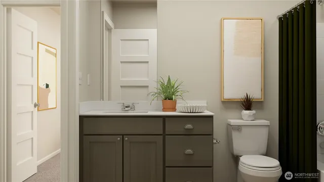 a bathroom with a sink a toilet and vanity