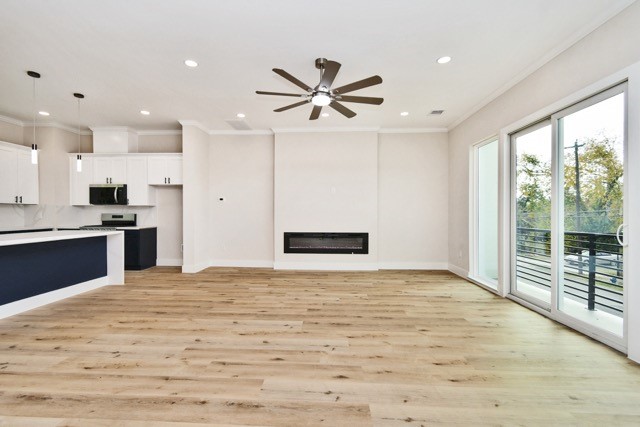 3233 Tuam Street Houston, TX 77004 - Photo 17 of 46 a view of kitchen with stainless steel appliances granite countertop cabinets and wooden floor