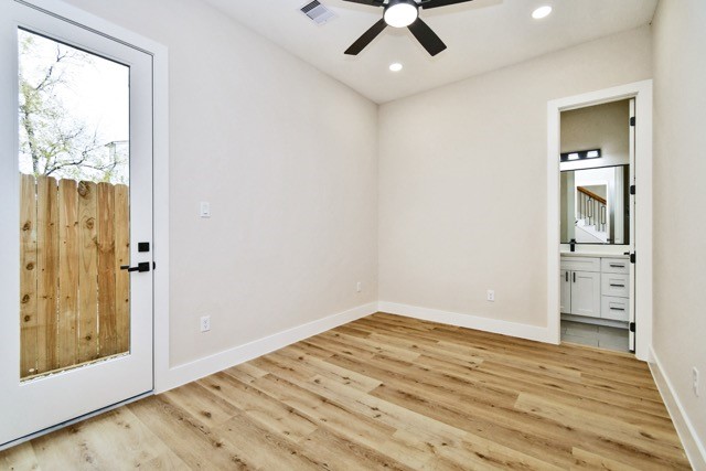 3233 Tuam Street Houston, TX 77004 - Photo 5 of 46 wooden floor in an empty room with a window