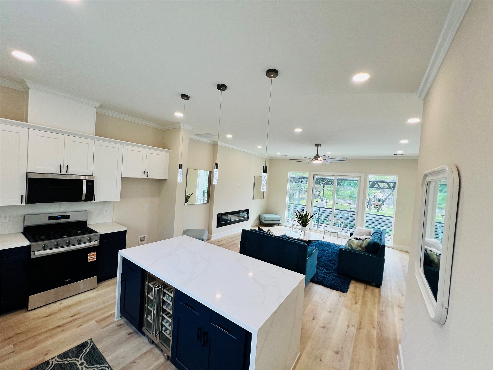 3233 Tuam Street Houston, TX 77004 - Photo 10 of 46 a kitchen with stainless steel appliances kitchen island granite countertop a refrigerator and a stove top oven