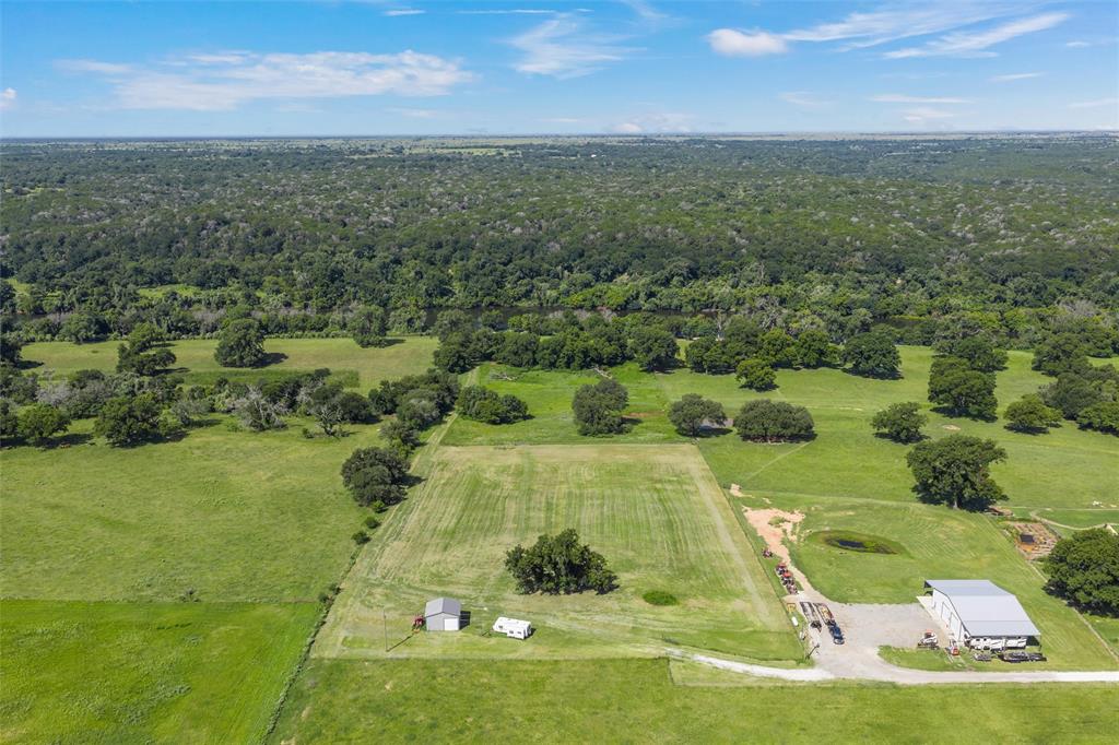101 Private Road Aquilla, TX 76622 - Photo 1 of 19 Aerial overview of property's location with a heavily wooded area and rural landscape