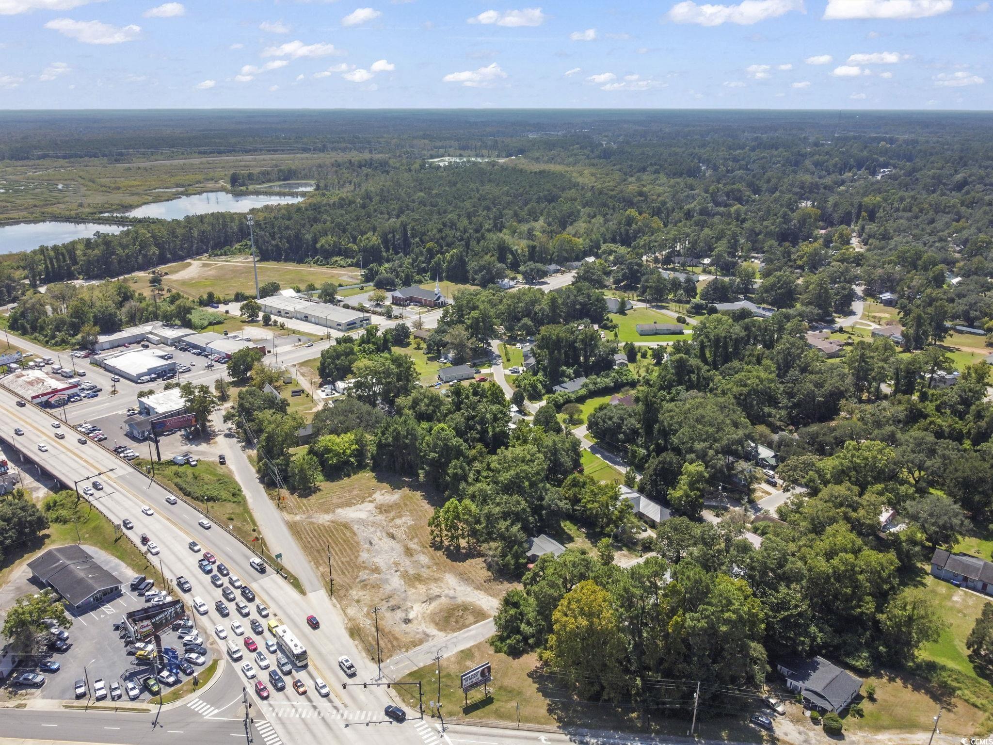 411 Apple Lane Conway, SC 29527 - Photo 3 of 9 Aerial view of property and surrounding area featuring a nearby body of water and a heavily wooded area