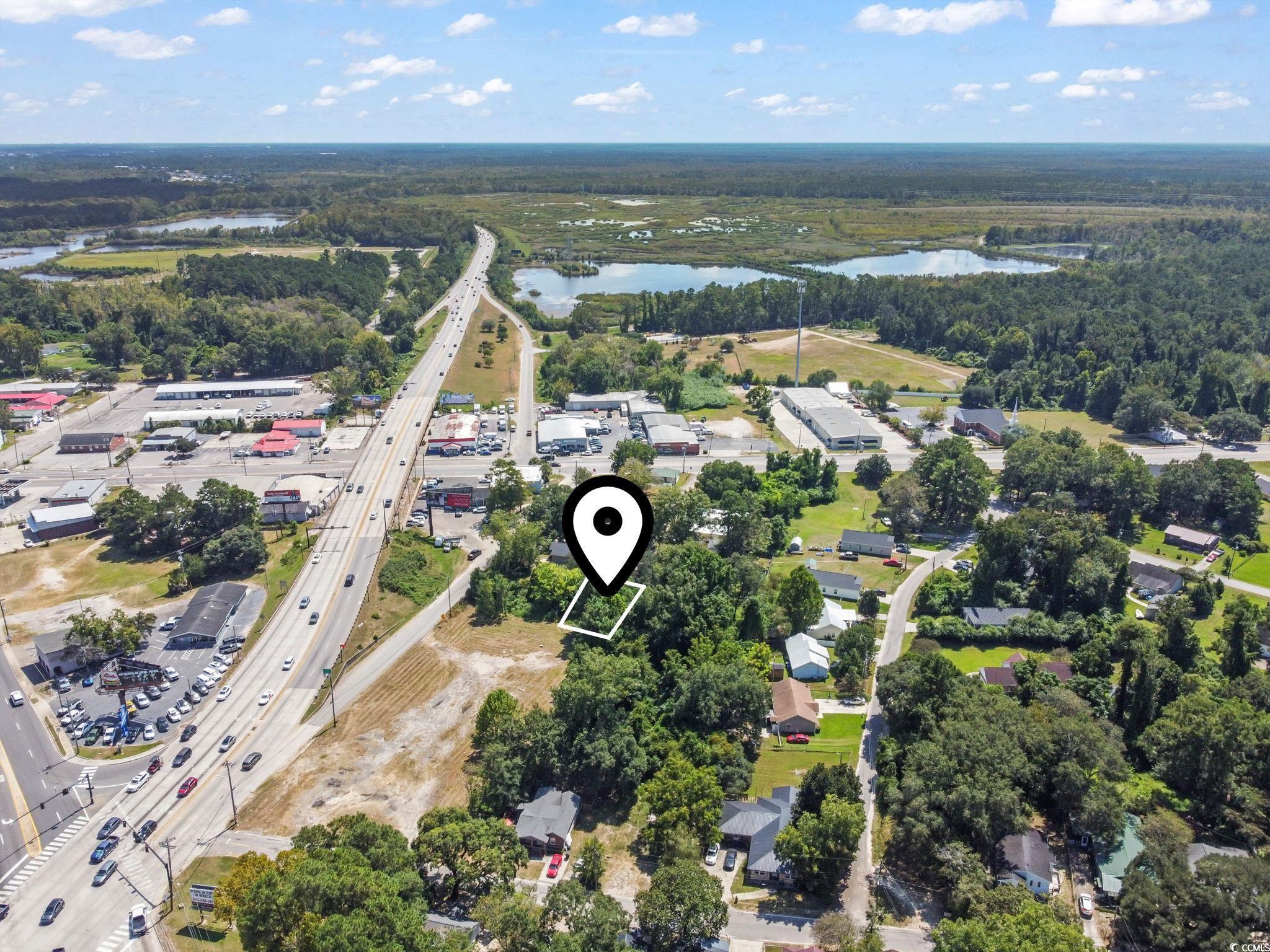 411 Apple Lane Conway, SC 29527 - Photo 4 of 9 Aerial view of property's location with a nearby body of water and a main thoroughfare