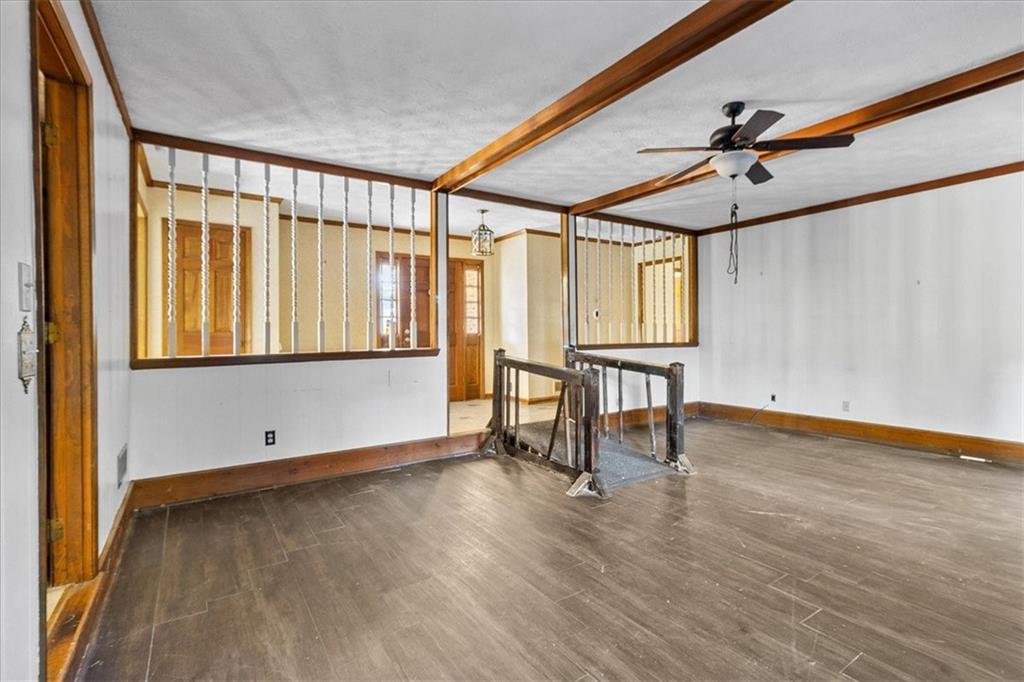 2075 Pinewood Drive Covington, GA 30016 - Photo 13 of 37 a view of an empty room with window and wooden floor