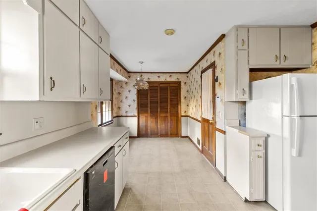 a view of an entryway with wooden floor and windows
