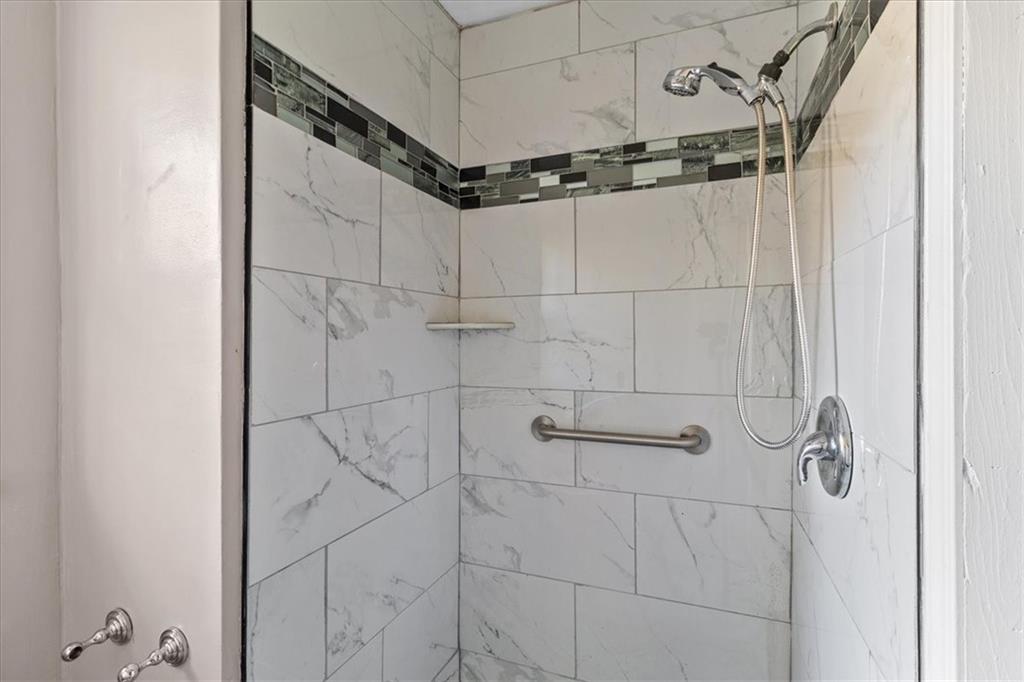 2075 Pinewood Drive Covington, GA 30016 - Photo 25 of 37 a bathroom with a shower