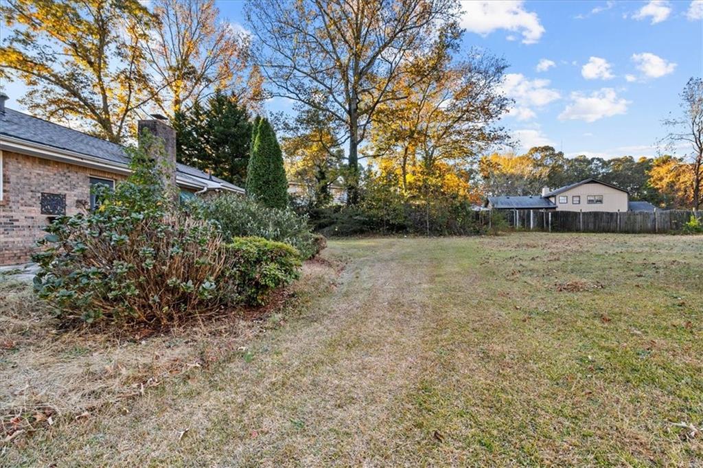 2075 Pinewood Drive Covington, GA 30016 - Photo 33 of 37 a view of a yard with plants and trees