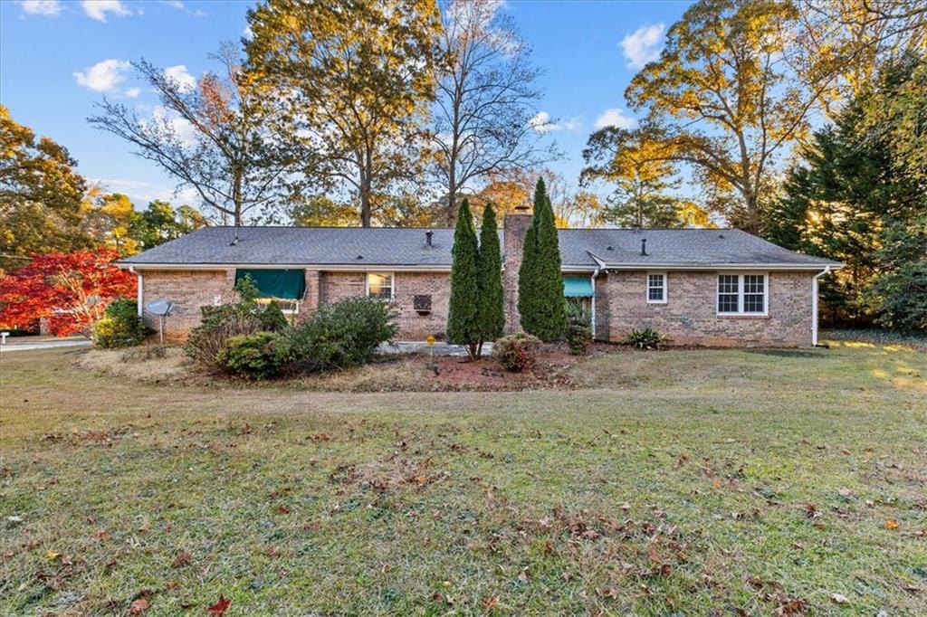 2075 Pinewood Drive Covington, GA 30016 - Photo 34 of 37 a front view of a house with a garden