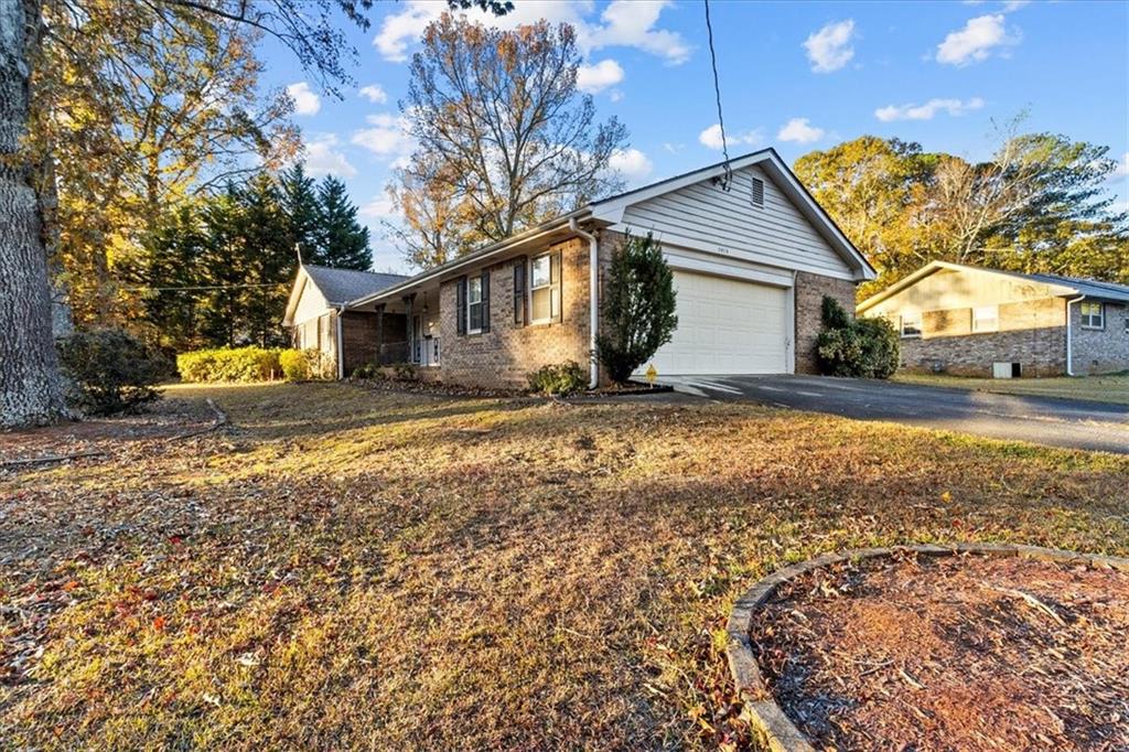 2075 Pinewood Drive Covington, GA 30016 - Photo 4 of 37 a view of a house with a yard