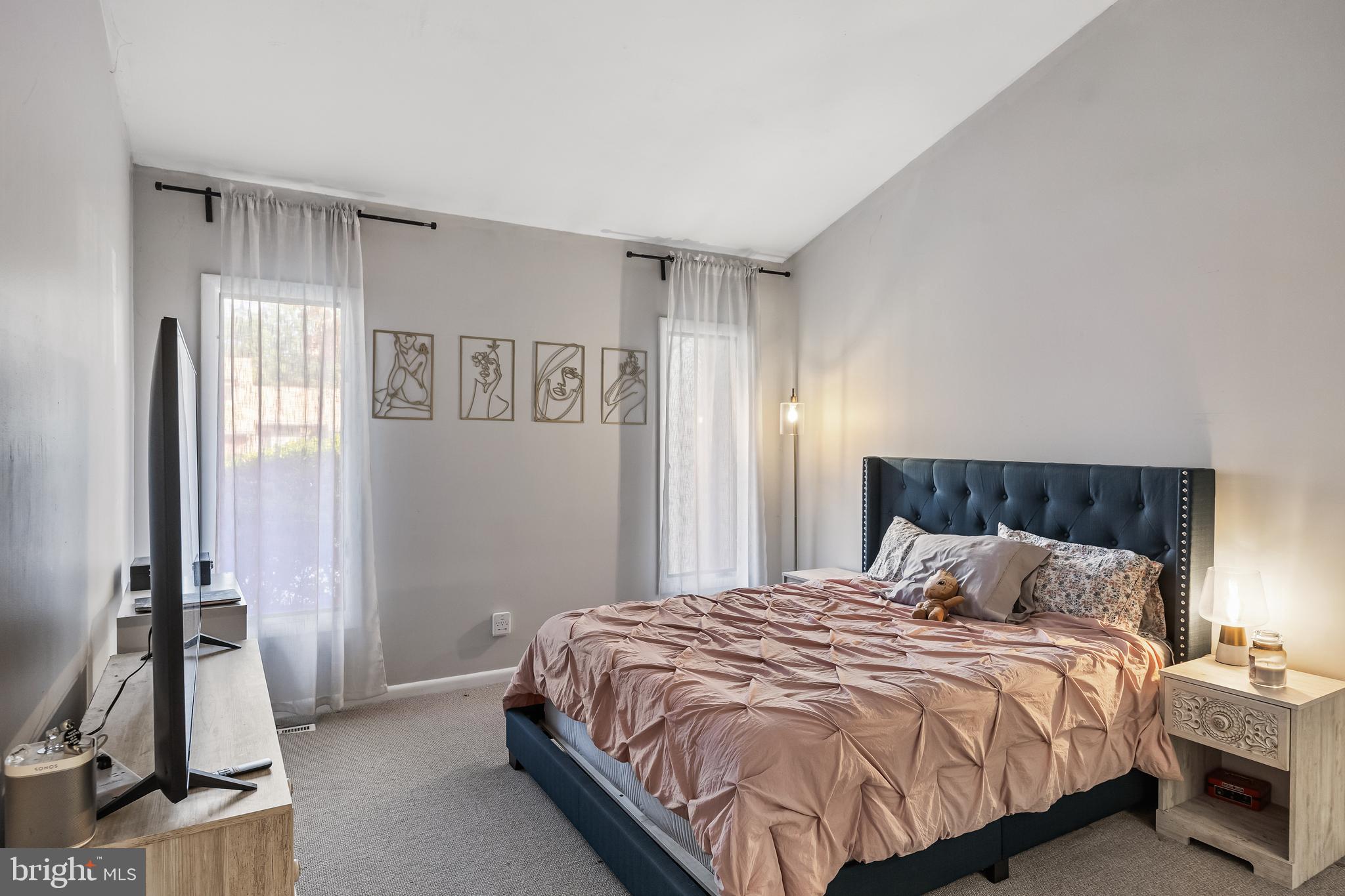 216 Uxbridge Cherry Hill, NJ 08034 - Photo 16 of 30 a bedroom with a bed and a flat tv screen on a dresser