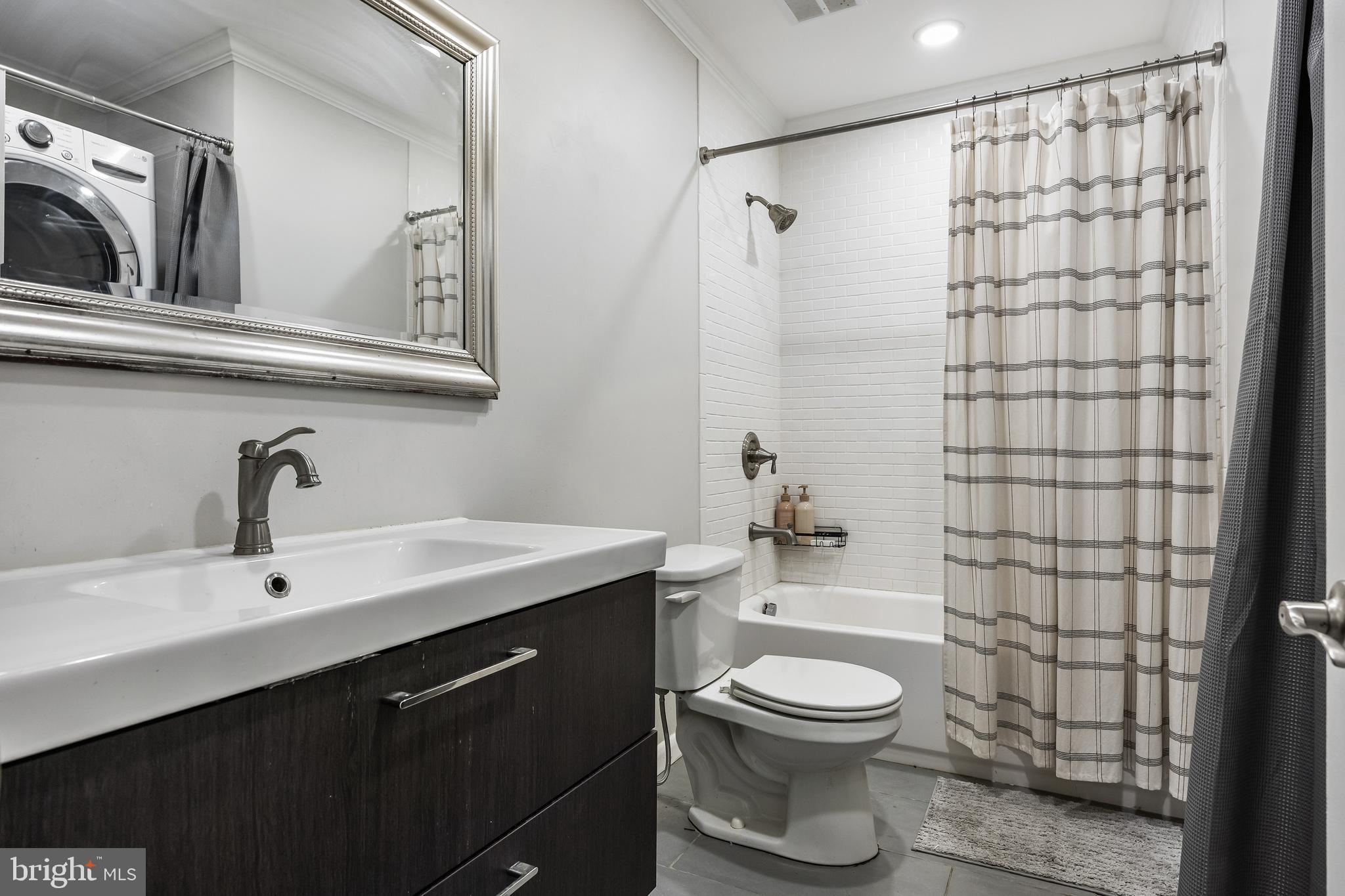 216 Uxbridge Cherry Hill, NJ 08034 - Photo 20 of 30 a bathroom with a toilet a sink and a shower