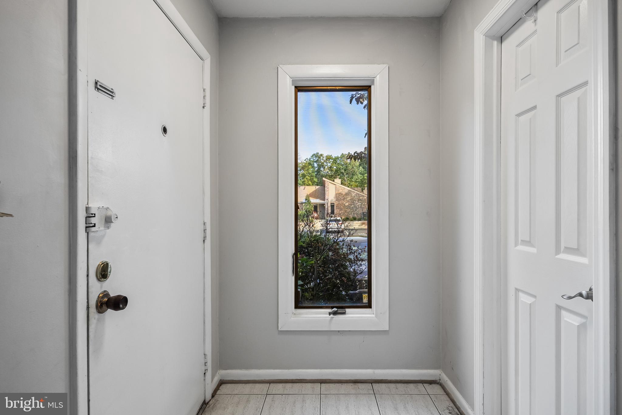 216 Uxbridge Cherry Hill, NJ 08034 - Photo 5 of 30 a view of an empty room with a window