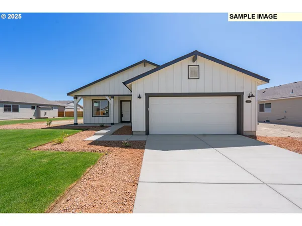a front view of a house with yard