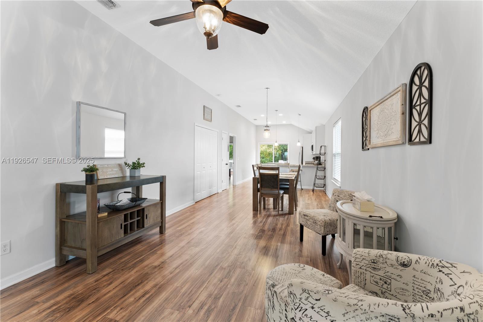 2 Poinciana Cove Road St. Augustine, FL 32084 - Photo 11 of 44 a living room with furniture and a wooden floor