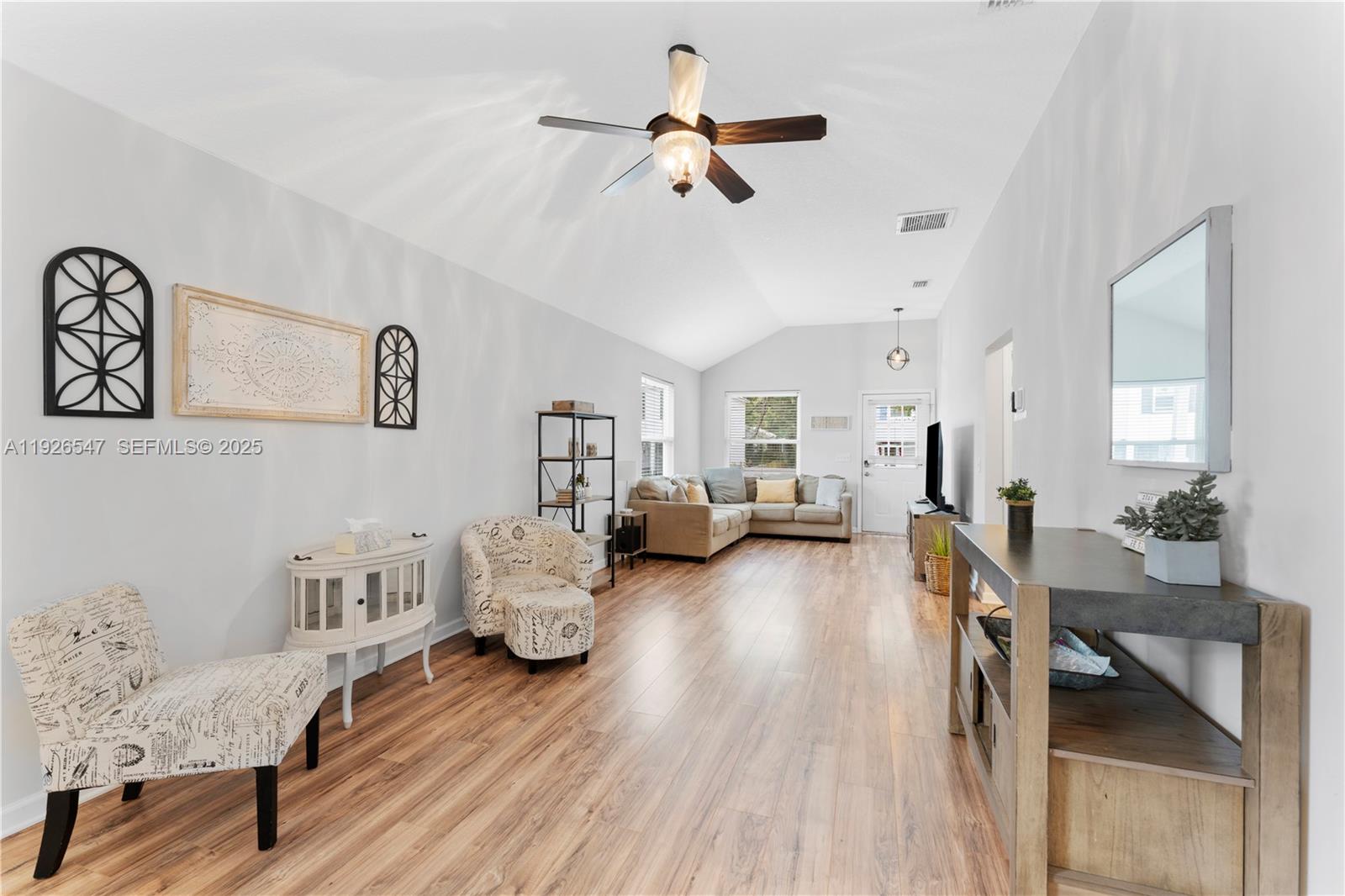 2 Poinciana Cove Road St. Augustine, FL 32084 - Photo 13 of 44 a living room with furniture and a wooden floor