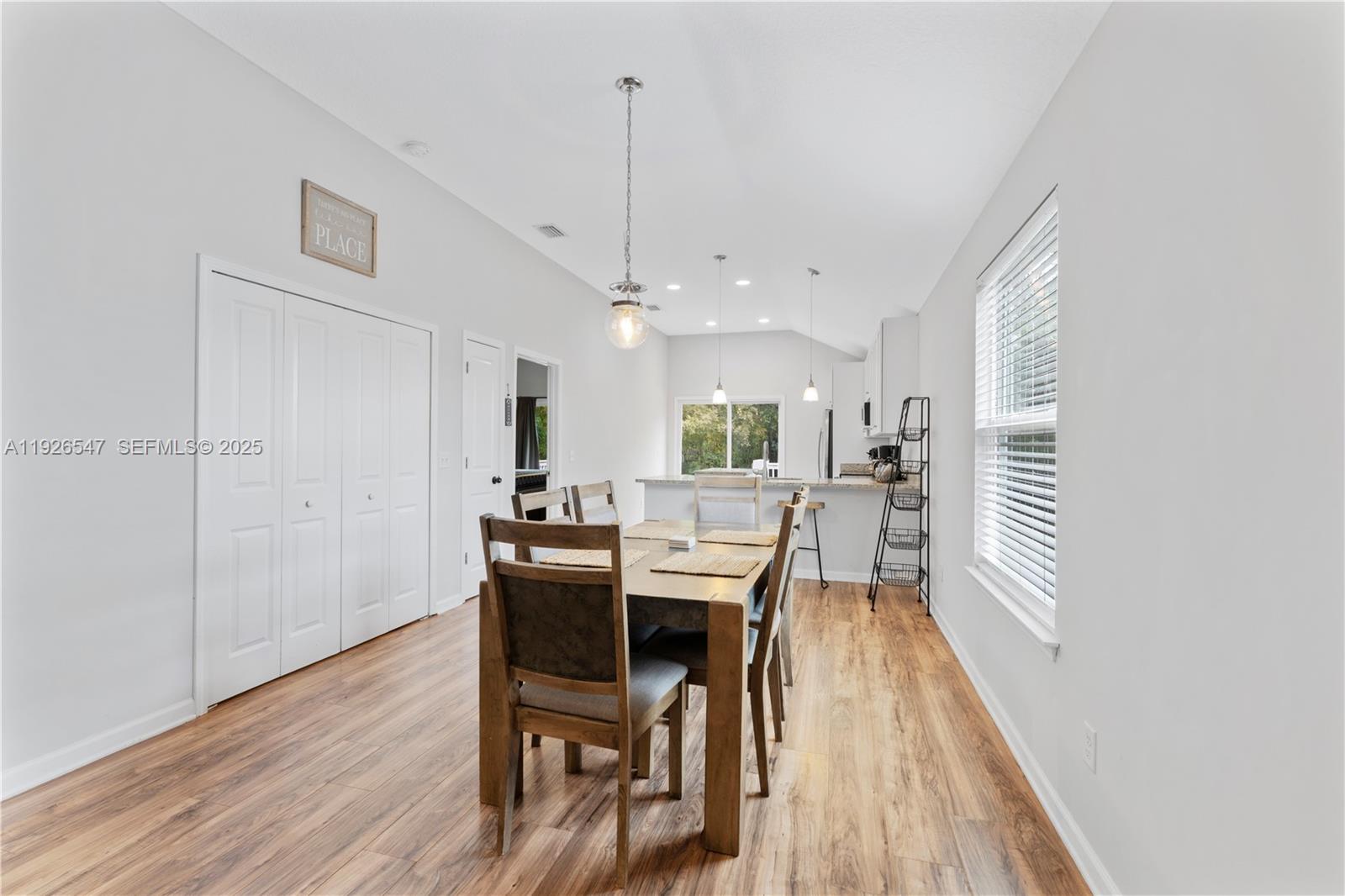 2 Poinciana Cove Road St. Augustine, FL 32084 - Photo 15 of 44 a dining room with furniture and wooden floor