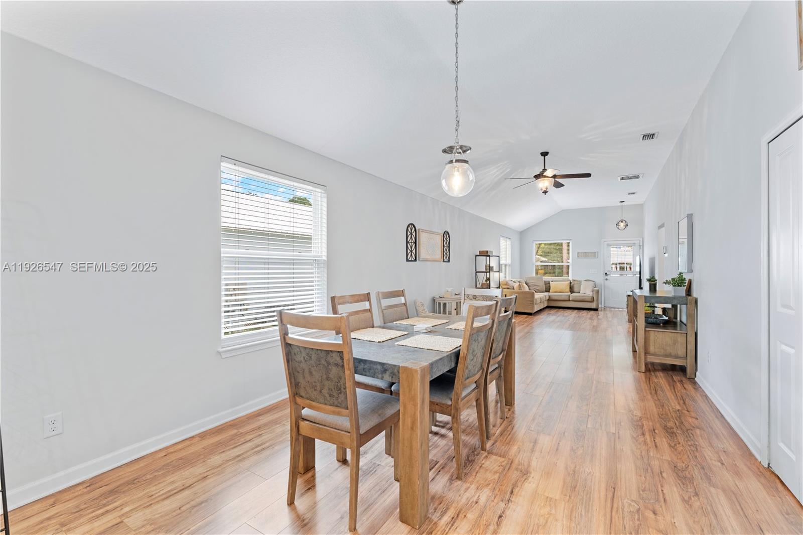 2 Poinciana Cove Road St. Augustine, FL 32084 - Photo 16 of 44 a view of a dining room with furniture and wooden floor