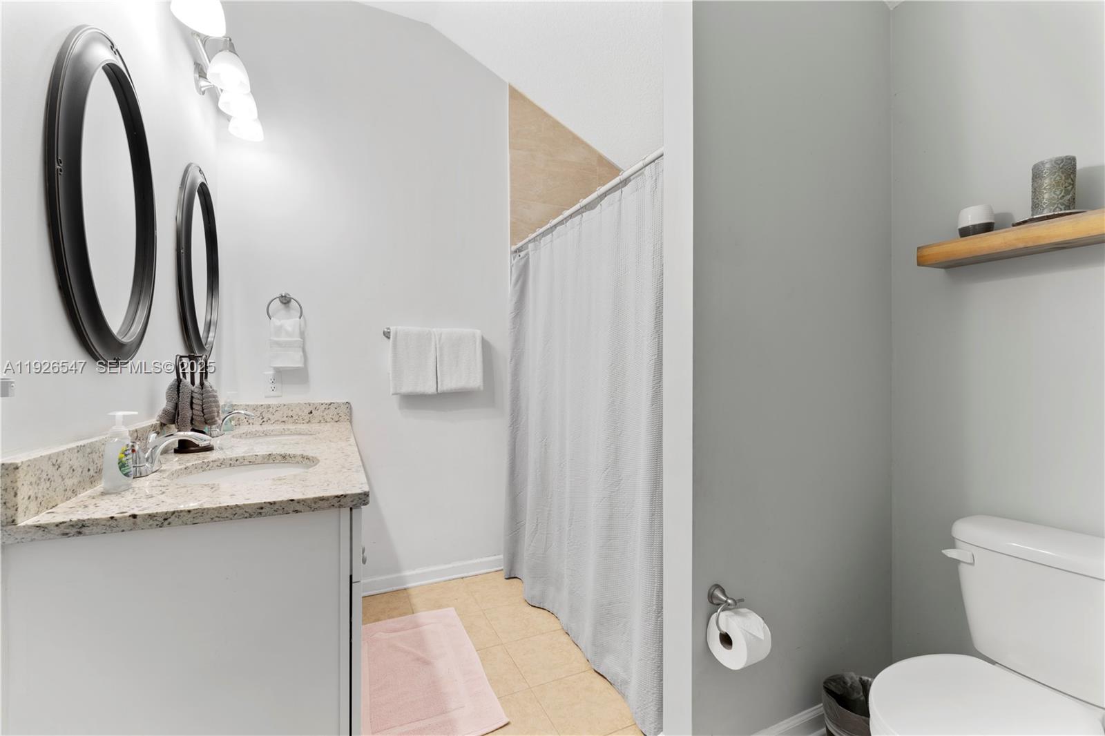 2 Poinciana Cove Road St. Augustine, FL 32084 - Photo 24 of 44 a bathroom with a granite countertop sink toilet and shower