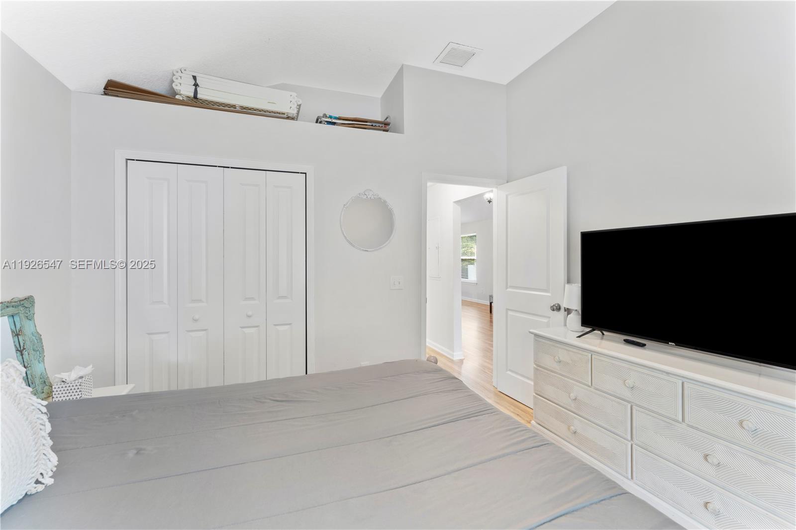 2 Poinciana Cove Road St. Augustine, FL 32084 - Photo 26 of 44 a hotel room with a bed and a flat screen tv