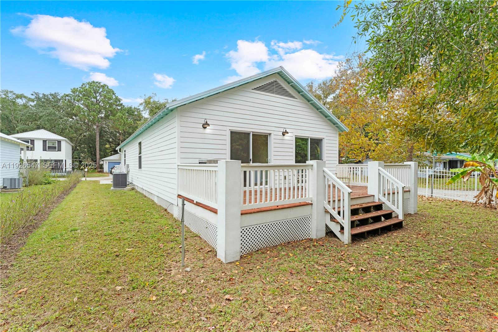 2 Poinciana Cove Road St. Augustine, FL 32084 - Photo 33 of 44 a view of a house with a backyard