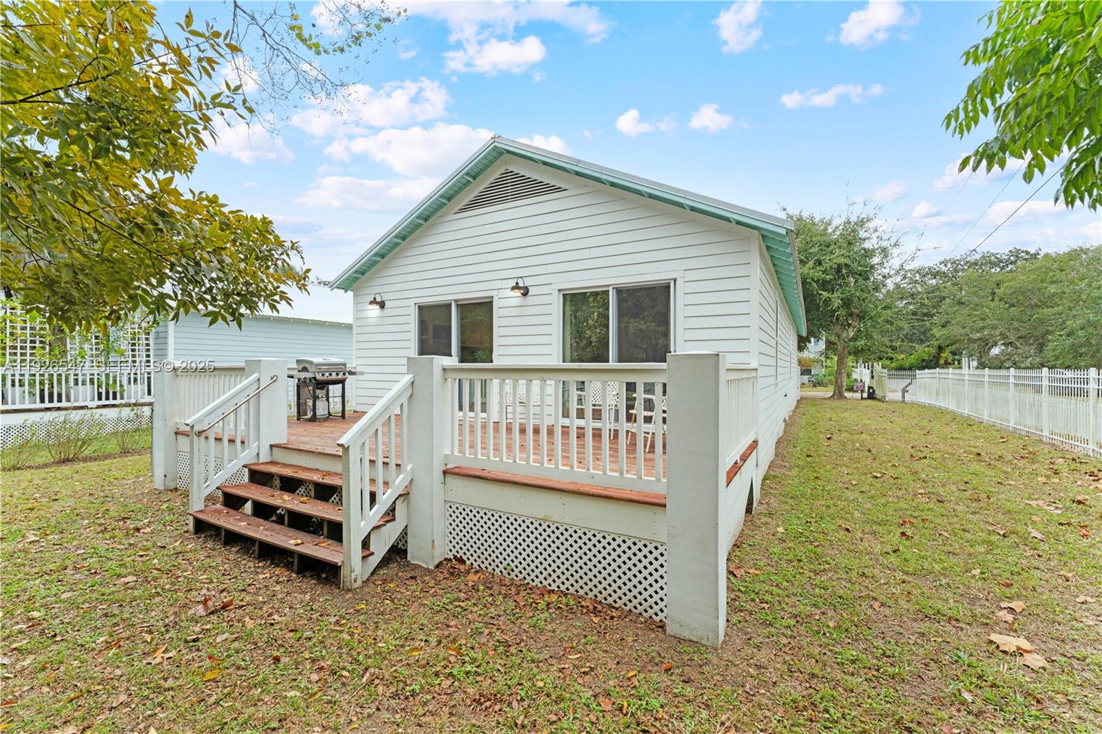 2 Poinciana Cove Road St. Augustine, FL 32084 - Photo 34 of 44 a view of a house with wooden fence