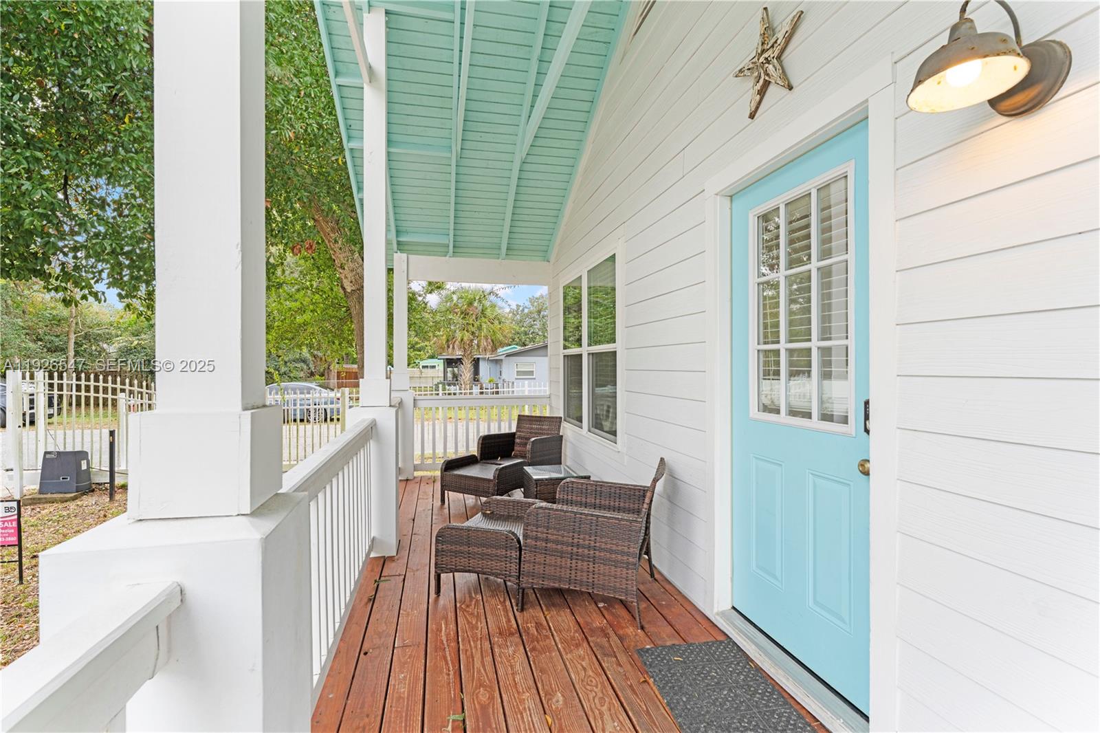 2 Poinciana Cove Road St. Augustine, FL 32084 - Photo 6 of 44 a balcony with furniture and wooden floor
