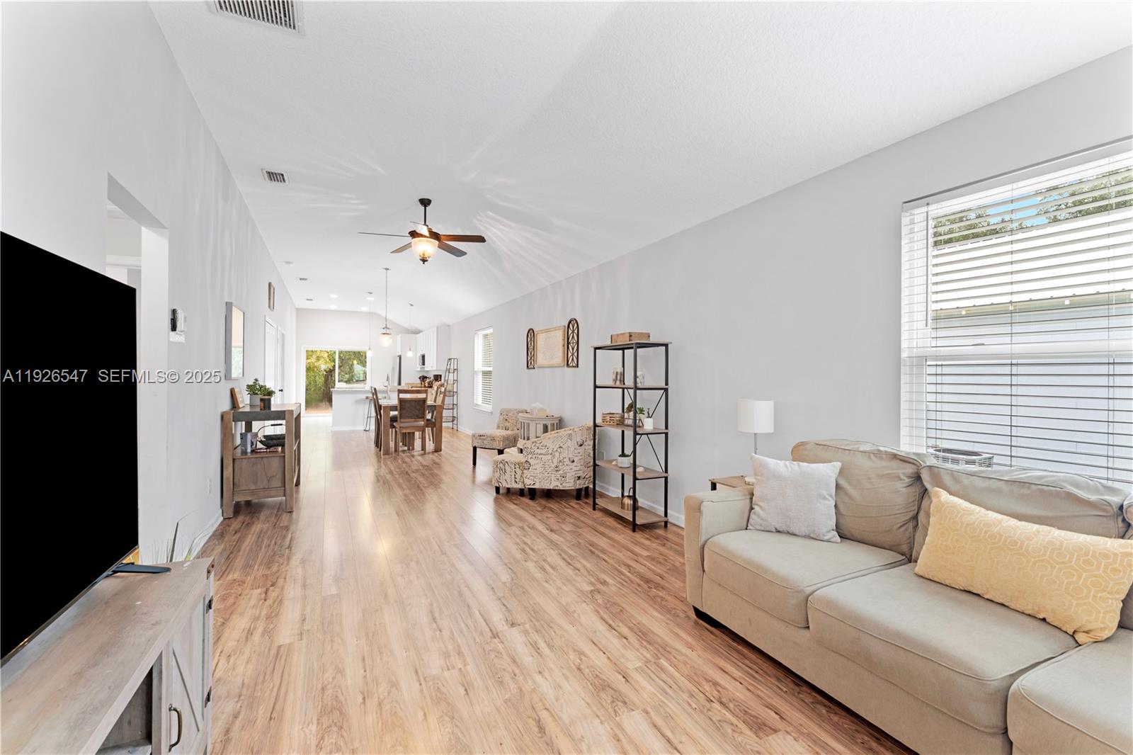 2 Poinciana Cove Road St. Augustine, FL 32084 - Photo 7 of 44 a living room with furniture and a large window