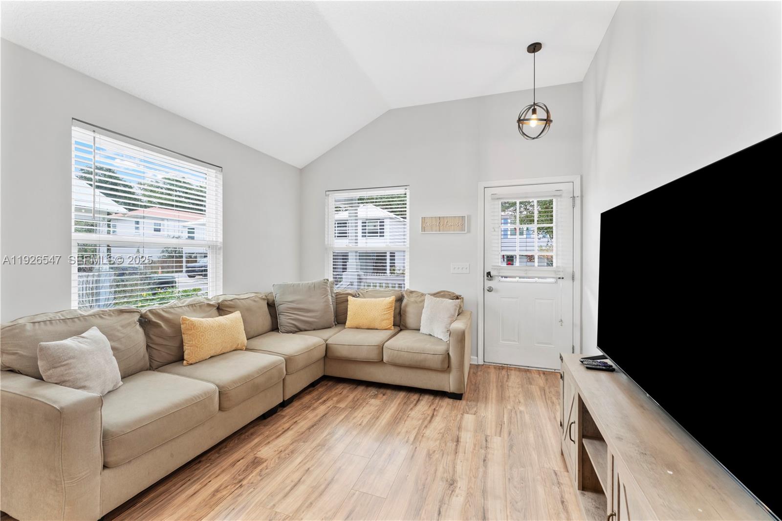 2 Poinciana Cove Road St. Augustine, FL 32084 - Photo 8 of 44 a living room with furniture window and a flat screen tv