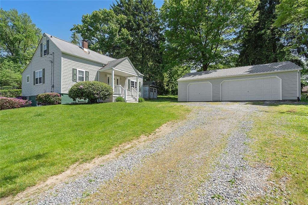 120 Tyler Road Pittsburgh, PA 15237 - Photo 1 of 23 a front view of a house with a yard and garage