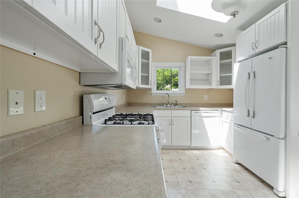 120 Tyler Road Pittsburgh, PA 15237 - Photo 13 of 23 a kitchen with stainless steel appliances granite countertop a refrigerator a stove a sink and a granite counter tops with white cabinets