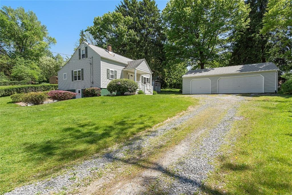 120 Tyler Road Pittsburgh, PA 15237 - Photo 2 of 23 a front view of a house with a yard and garage