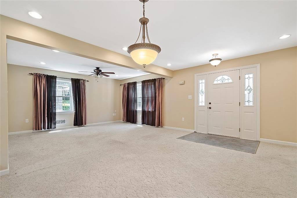 120 Tyler Road Pittsburgh, PA 15237 - Photo 4 of 23 a view of an empty room with a chandelier