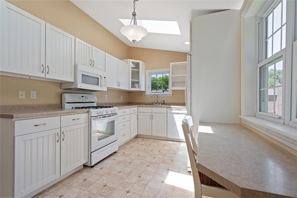 120 Tyler Road Pittsburgh, PA 15237 - Photo 10 of 23 a kitchen with granite countertop white cabinets and white appliances