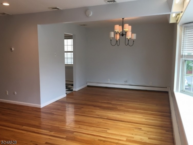 38 Emily Avenue, Unit 2 Union, NJ 07088 - Photo 4 of 9 wooden floor in an empty room with a window
