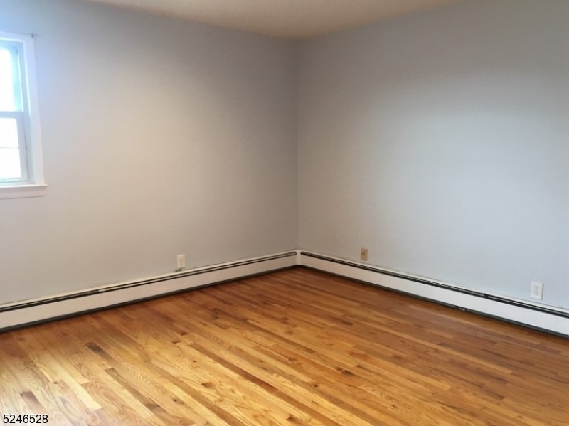 38 Emily Avenue, Unit 2 Union, NJ 07088 - Photo 6 of 9 a view of empty room with wooden floor