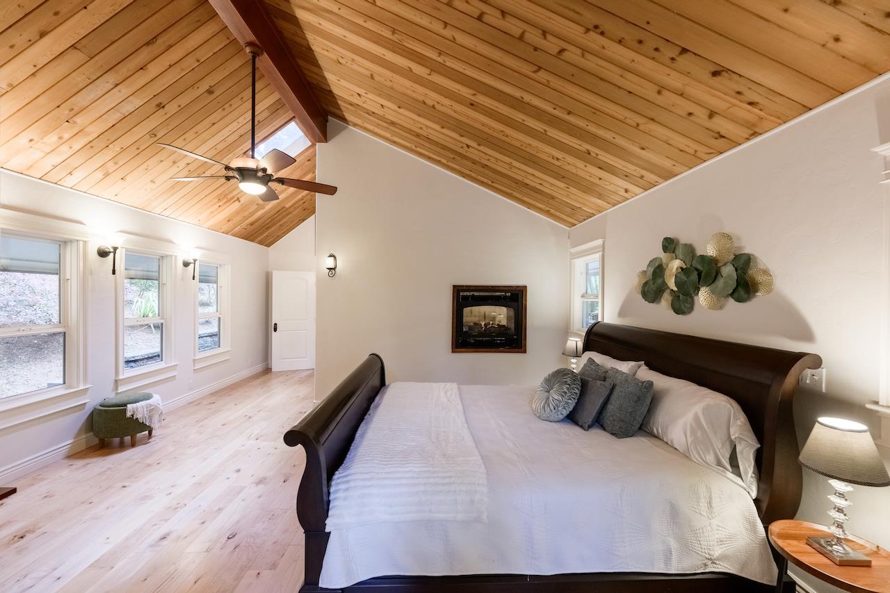 295 Jim's Road Ben Lomond, CA 95005 - Photo 57 of 139 a bedroom with a bed and wooden floor
