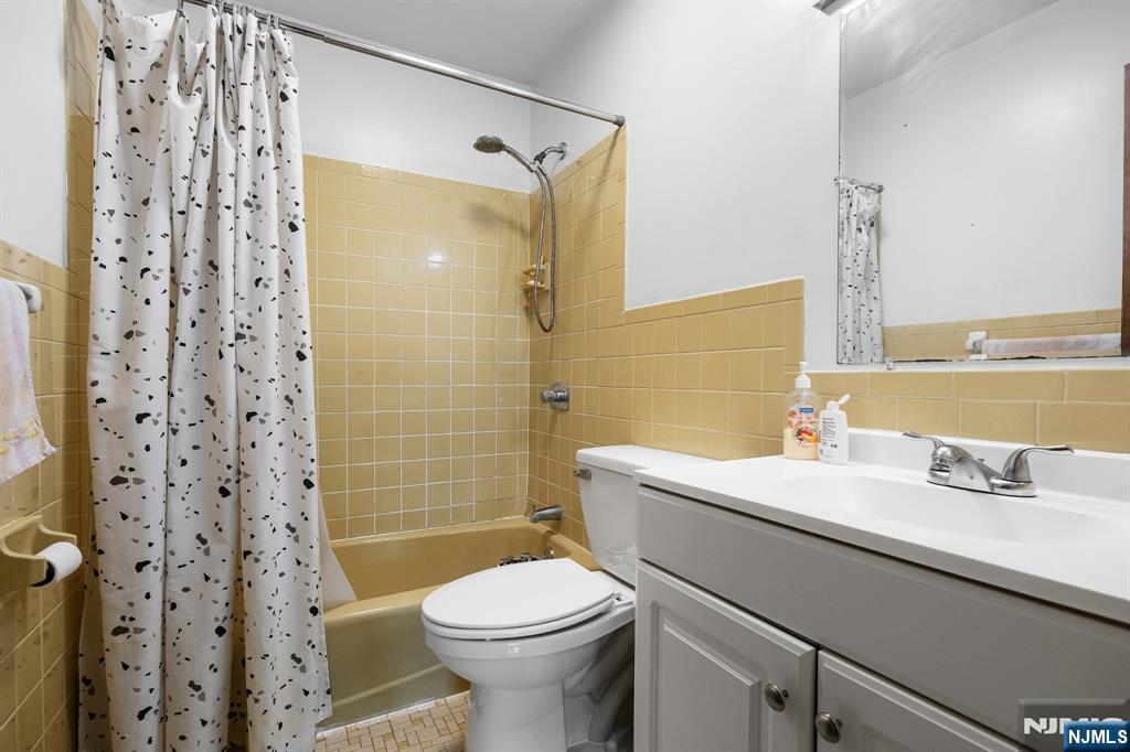 747 Riverside Avenue, Unit C1 Lyndhurst, NJ 07071 - Photo 11 of 16 a bathroom with a sink a toilet and shower