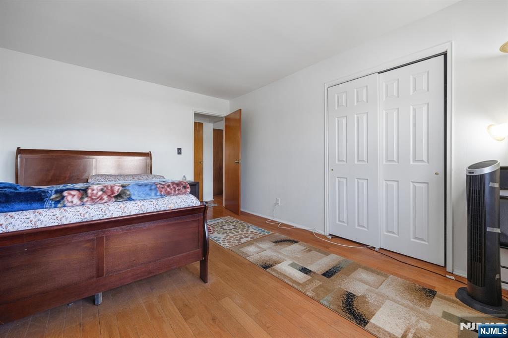 747 Riverside Avenue, Unit C1 Lyndhurst, NJ 07071 - Photo 13 of 16 a bed room with a bed and a television