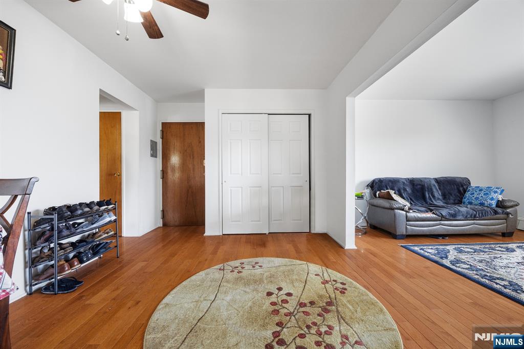747 Riverside Avenue, Unit C1 Lyndhurst, NJ 07071 - Photo 2 of 16 a living room with furniture and a wooden floor